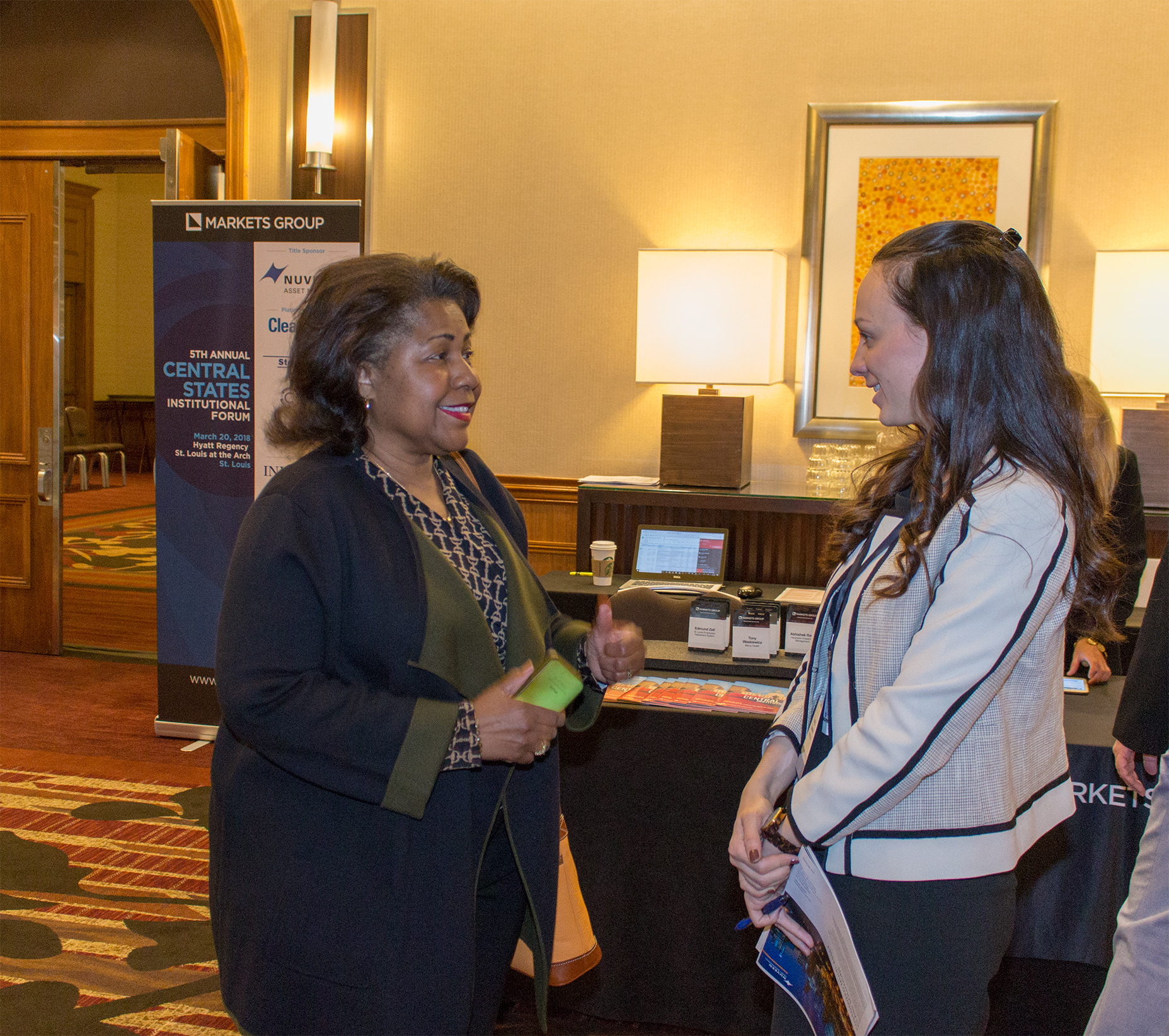 Comptroller Green is greeted by Georgia Quinones of Markets Group at the Central States Institutional Investors Forum.