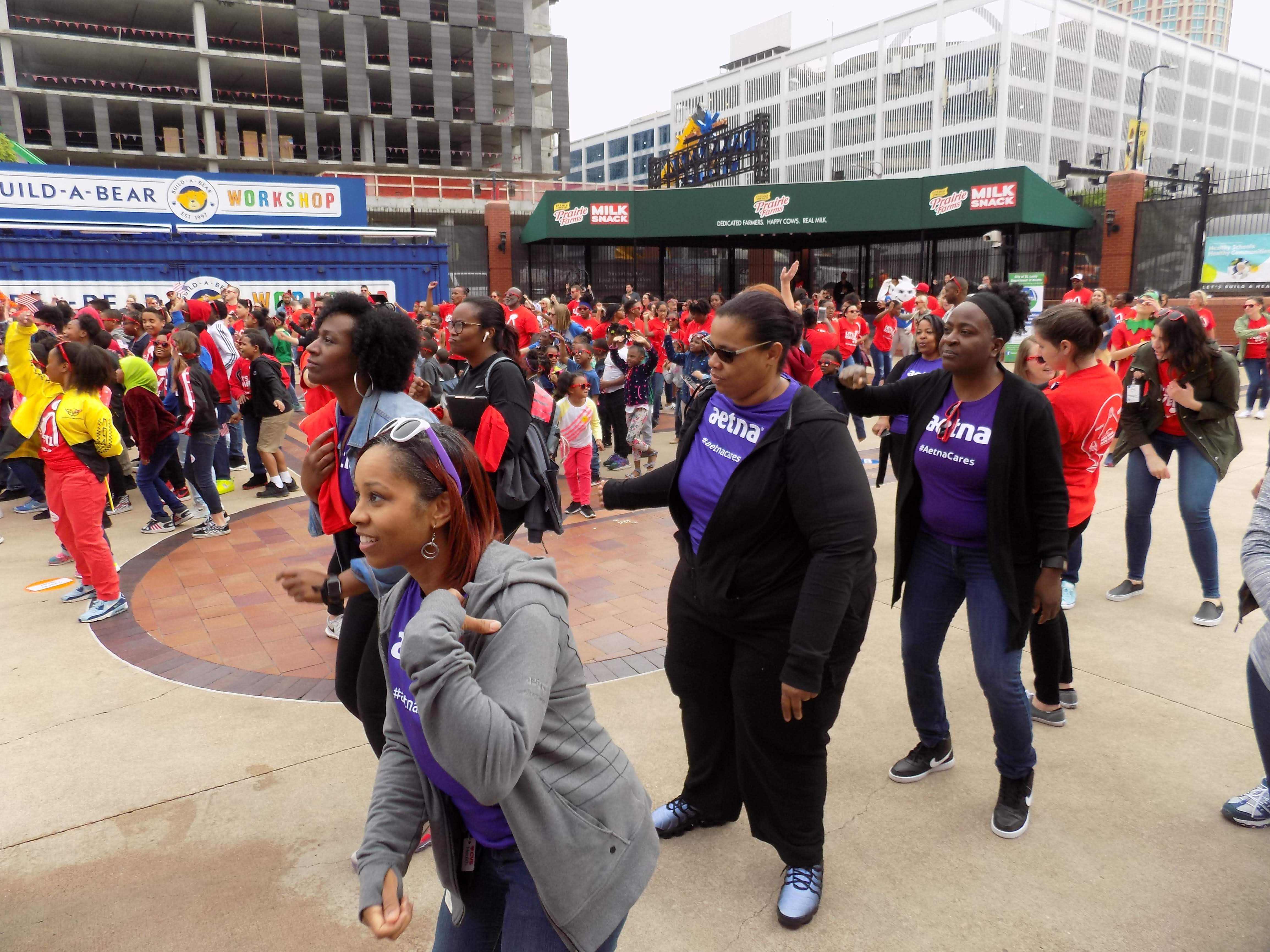 Atena staff move and groove to the Flash Mob music