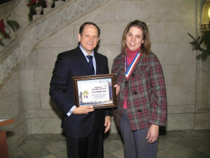 Christine Boyer from Office on the Disabled receiving the Mayor's Service Award from Mayor Slay.