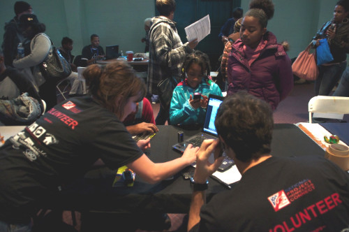 Volunteers helping clients.