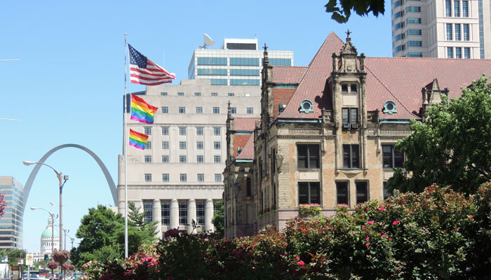 Pride-flags-over-city-hall-and-arch