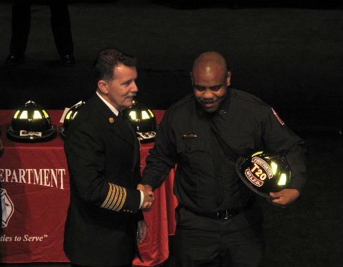 St. Louis Fire Chief Dennis Jenkerson and new firefighter Jesse Jackson