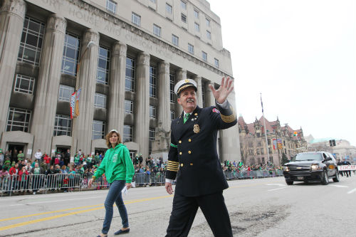 St. Louis Fire Chief Dennis Jenkerson waves to the crowd during the 2015 St. Patrick's Day Parade Downtown on 3.14.15.