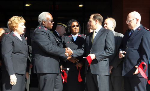 Congratulations all around after the ribbon cutting on the new Salvation Army Veterans Residence on Nov. 8, 2012