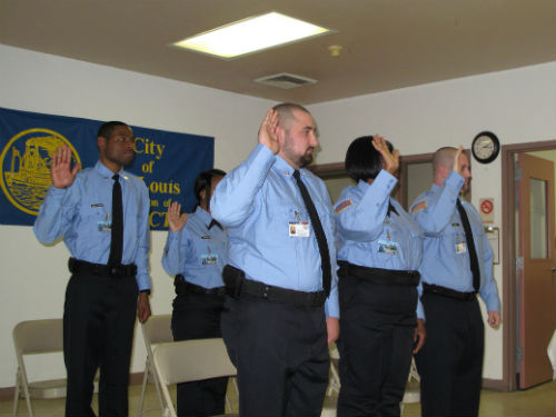 The members of the class take the Oath of Office.
