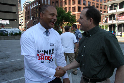 E. St. Louis Mayor Alvin Parks and St. Louis Mayor Francis Slay greet each other at the 2013 Walk A Mile in Her Shoes events on June 18, 2013.