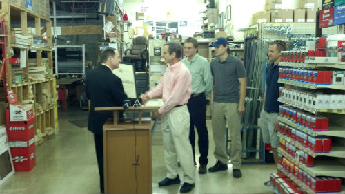 Mayor Slay presents a proclamation to the Hromadka Family, owners of Vincent's 12th Street Market.