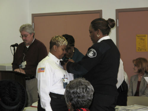 Major Tonya Harry had the honor of pinning on the officers' badges