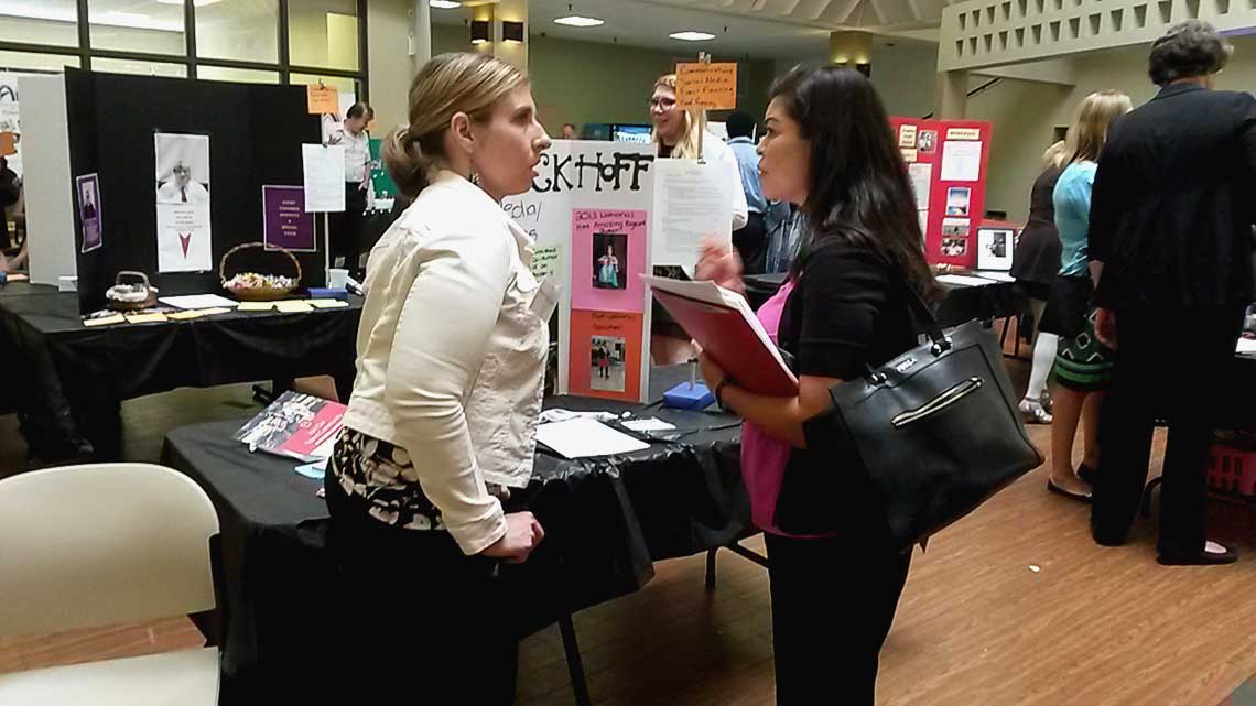 Employers interact with Job Fair participant