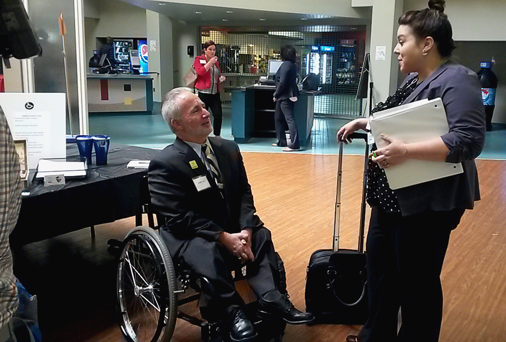 Employer interacts with Job Fair participant